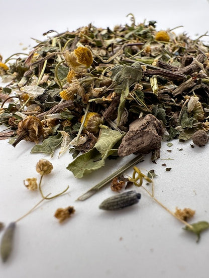 An image featuring herbalism products, including various herbs, oils, and natural ingredients, arranged for holistic wellness and self-care